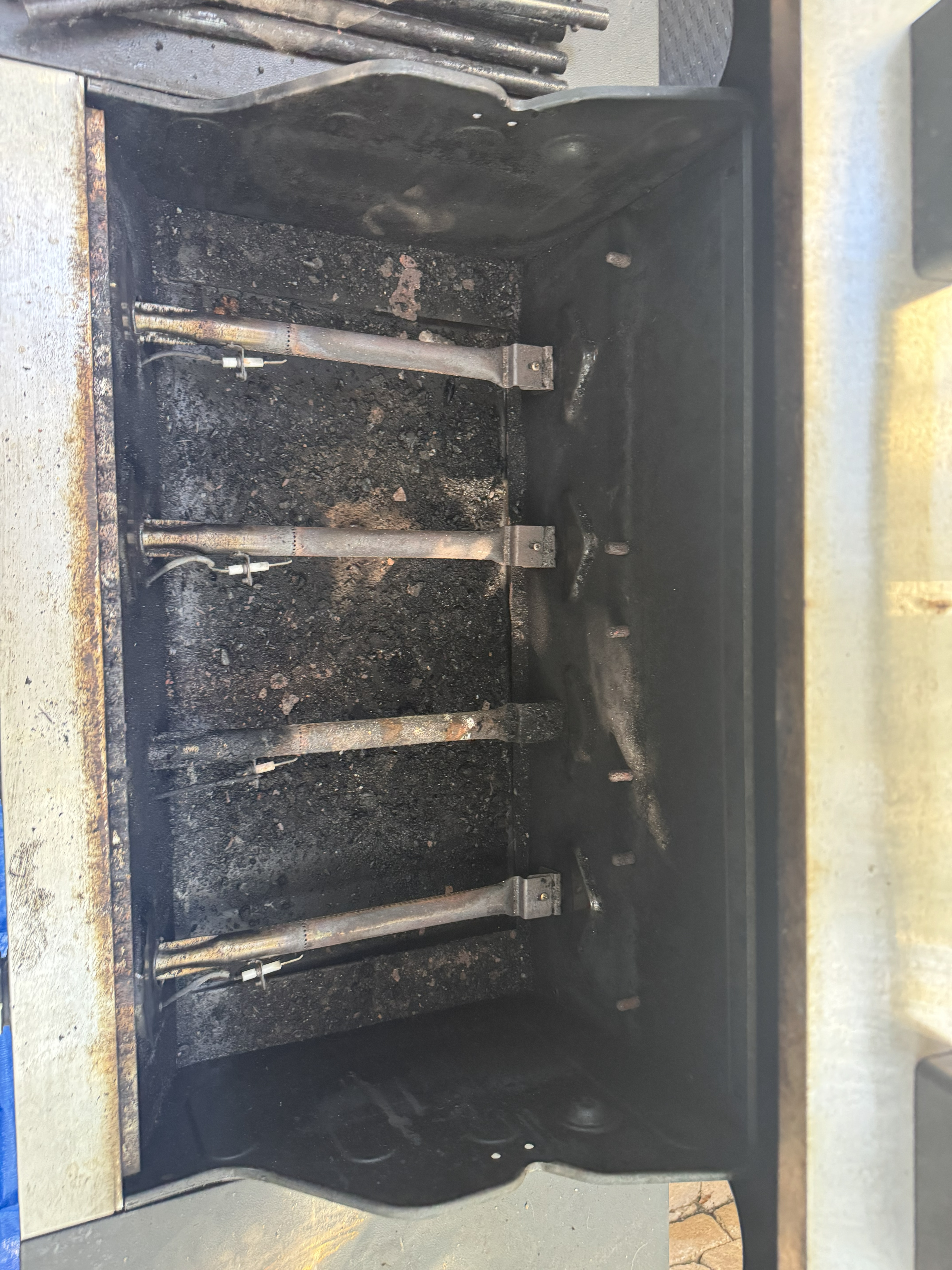 Before — stainless and grates with heavy buildup