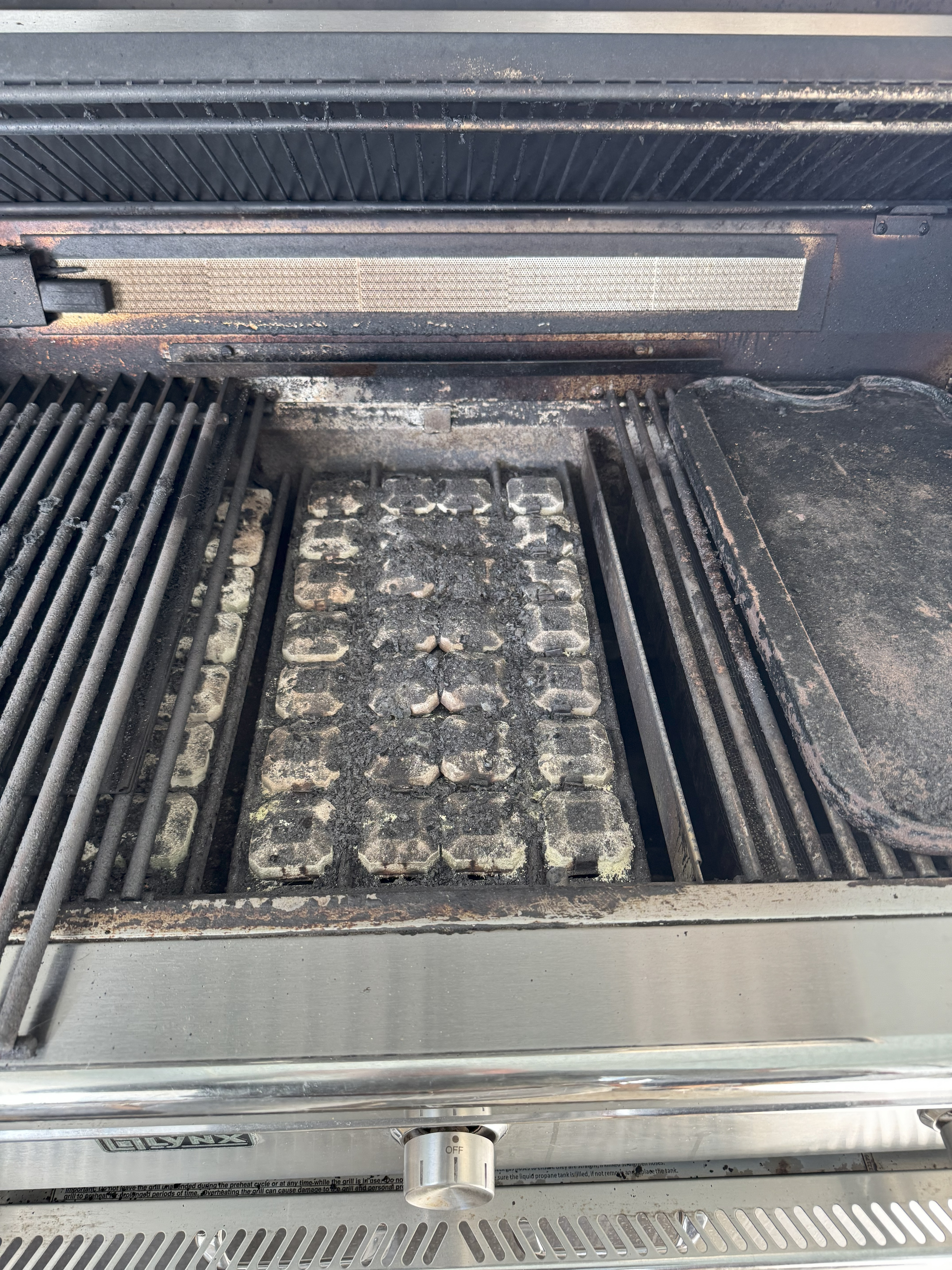 Before — grates with carbon buildup